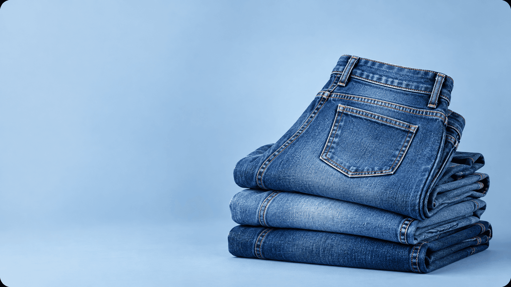 Stack of folded blue denim jeans